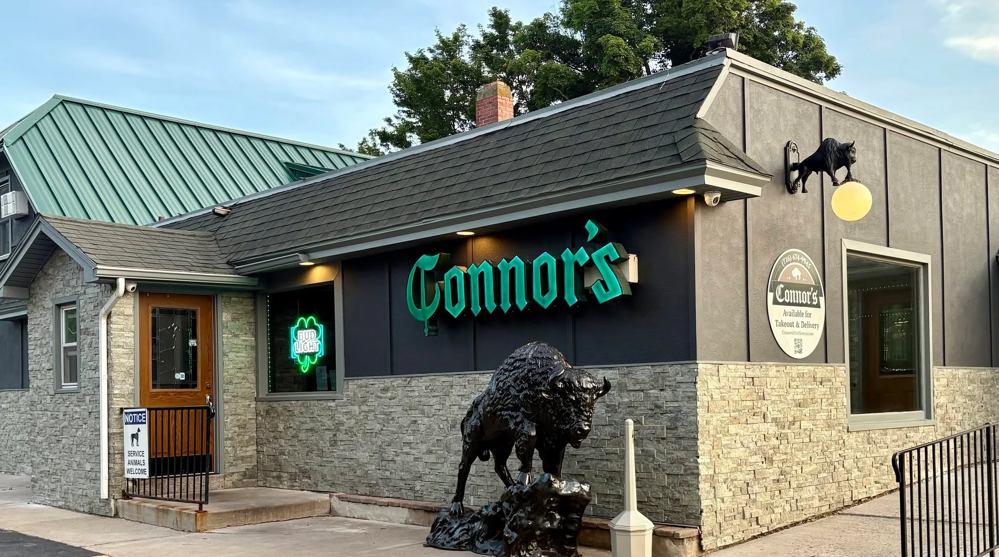 Exterior view of Connor's restaurant with unique decor and signage