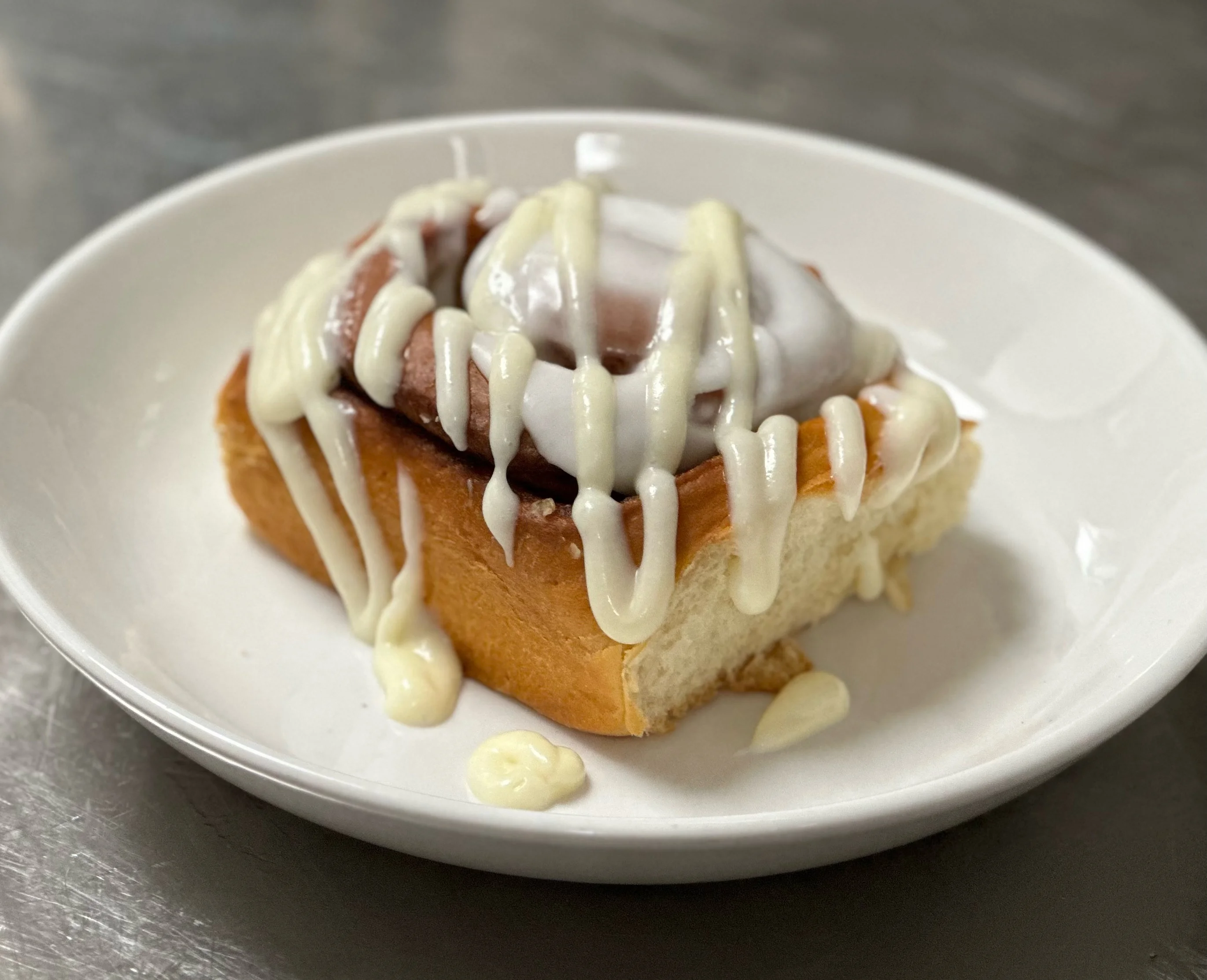 Freshly baked cinnamon rolls with icing