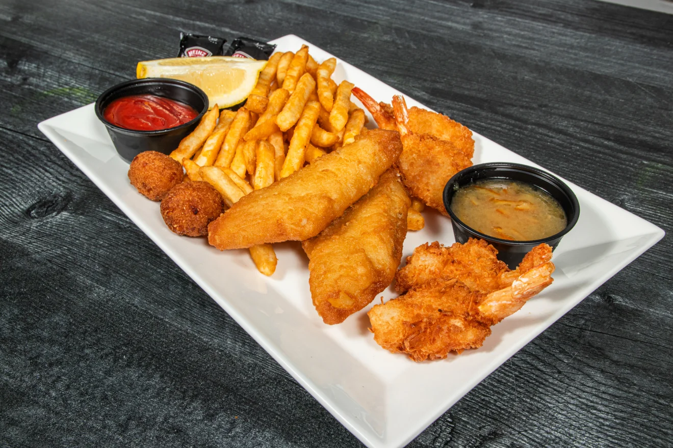 A delicious seafood basket featuring various fried seafood items.
