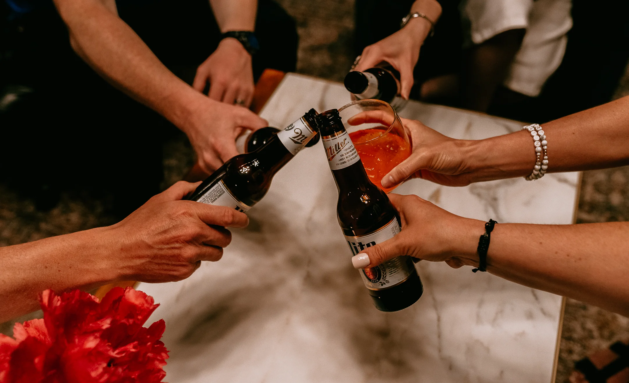 Cheers with beers and cocktails at a social gathering