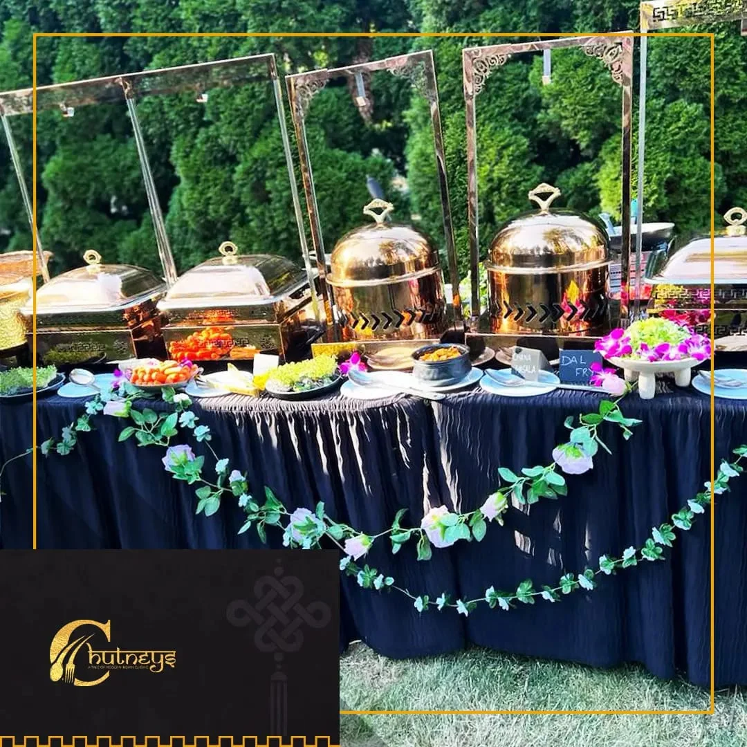 Elegant buffet setup with Indian dishes and decorative elements