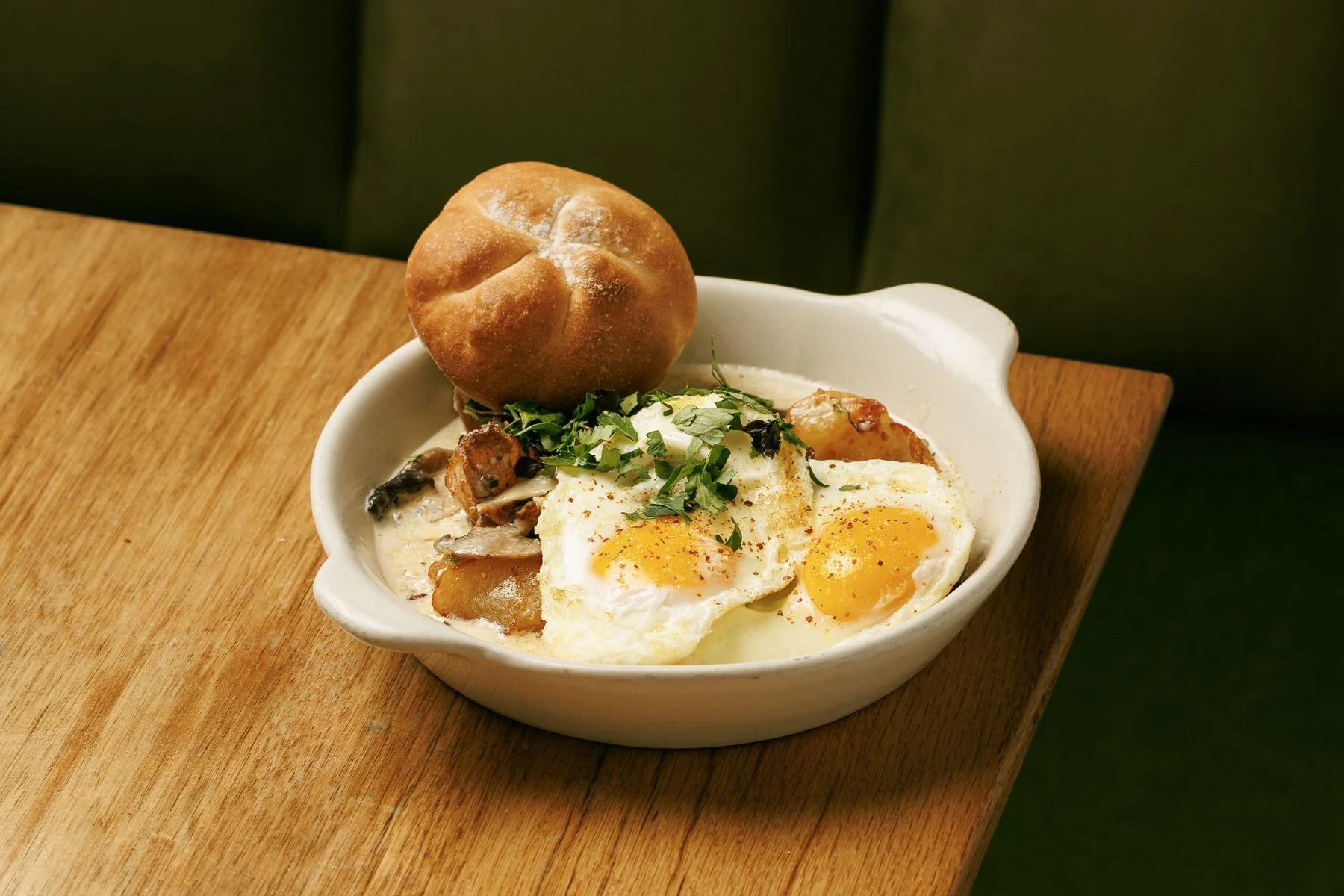 Eggs baked with Georgian sauce and a bread roll