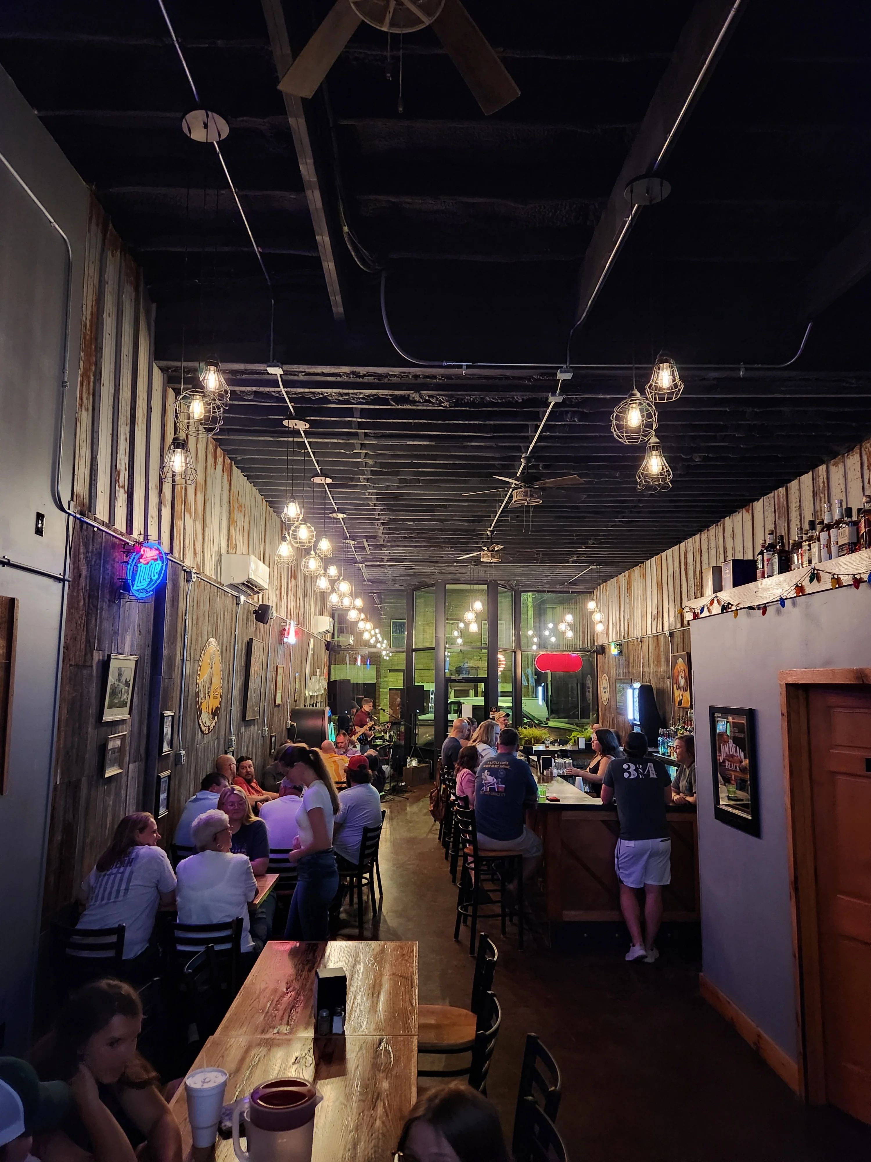 Cozy restaurant interior with warm lighting and rustic decor