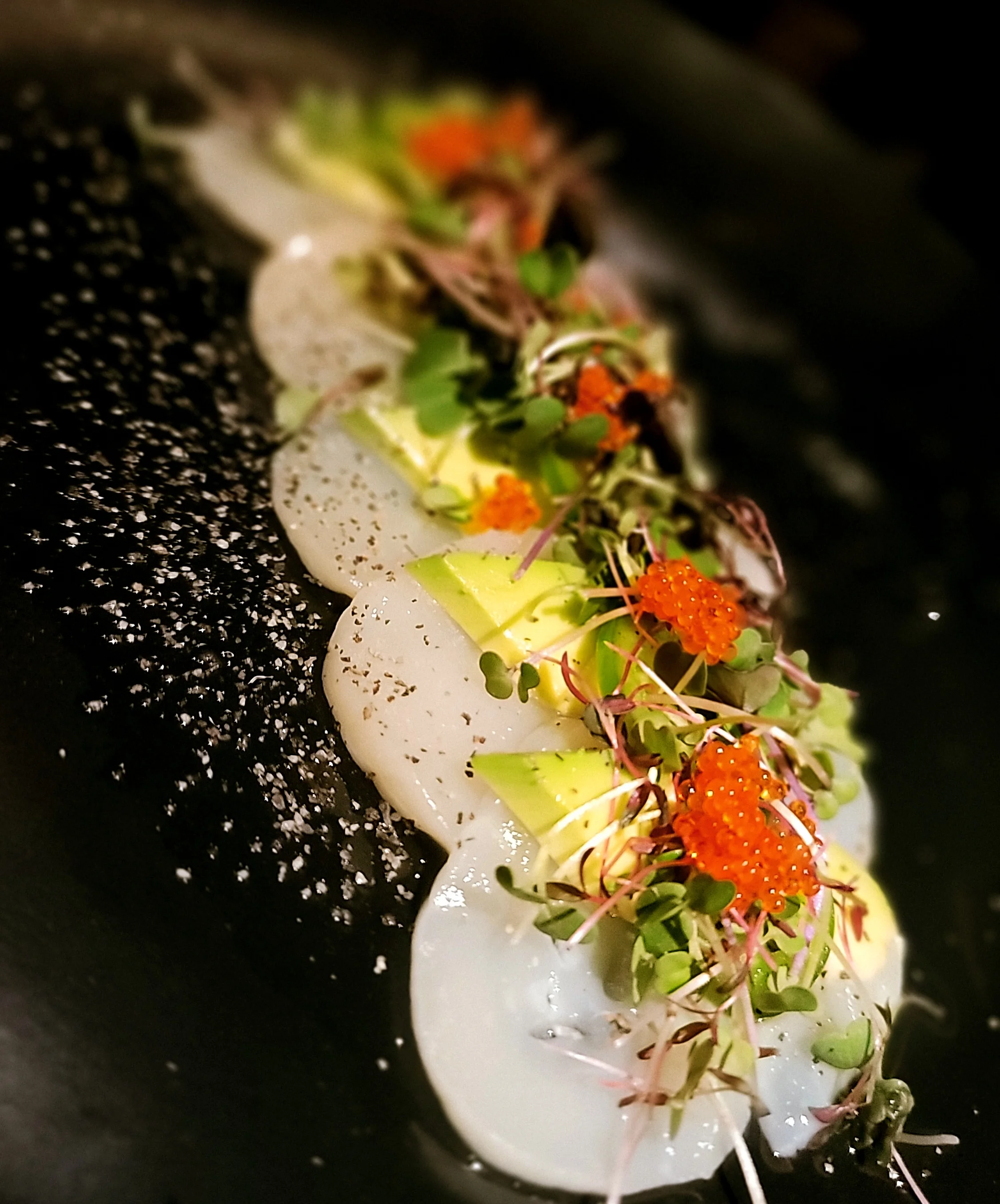 Japanese sashimi platter with fresh seafood and garnishes