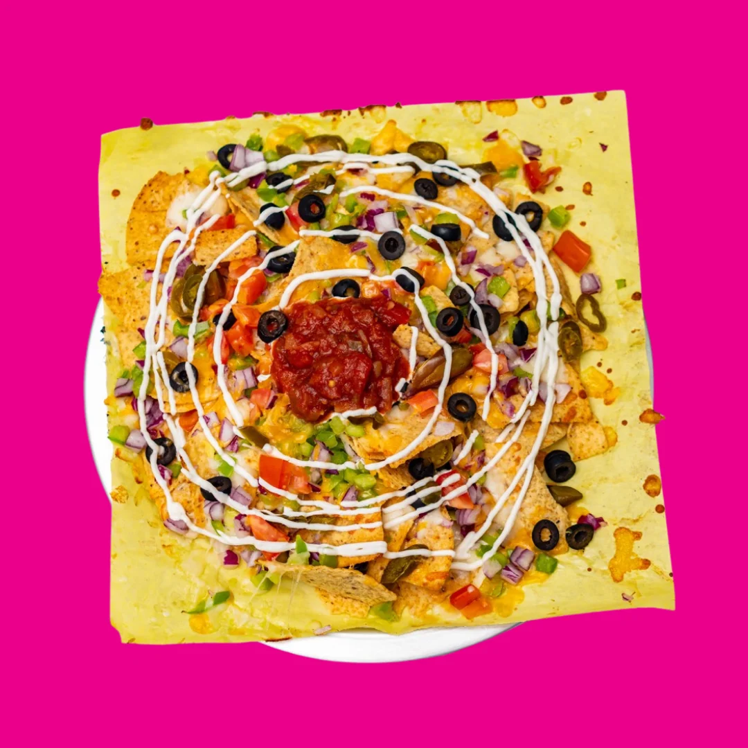 Colorful plate of nachos with toppings