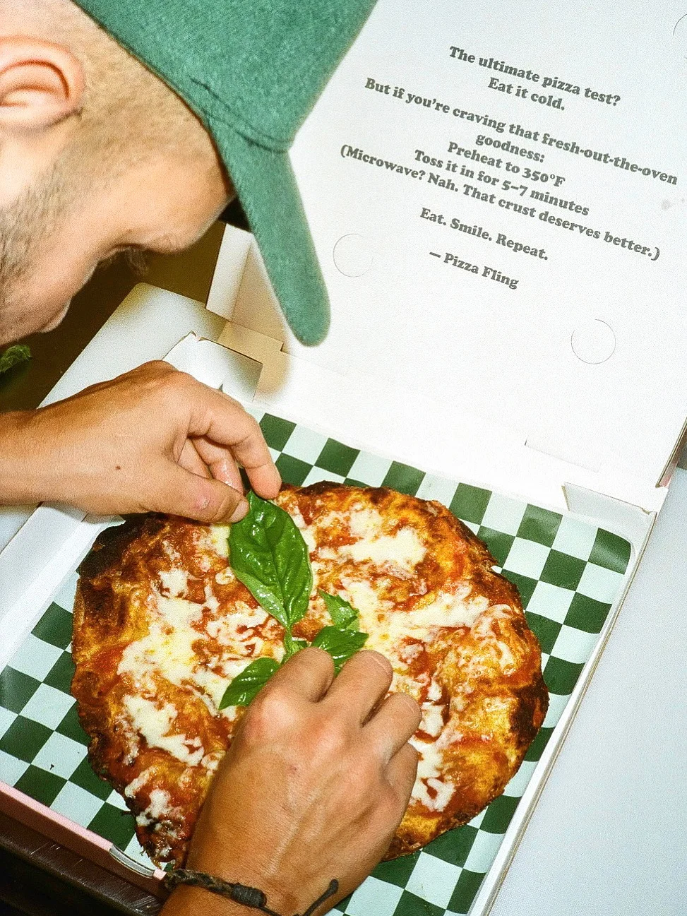 Fresh Margherita pizza with basil leaves