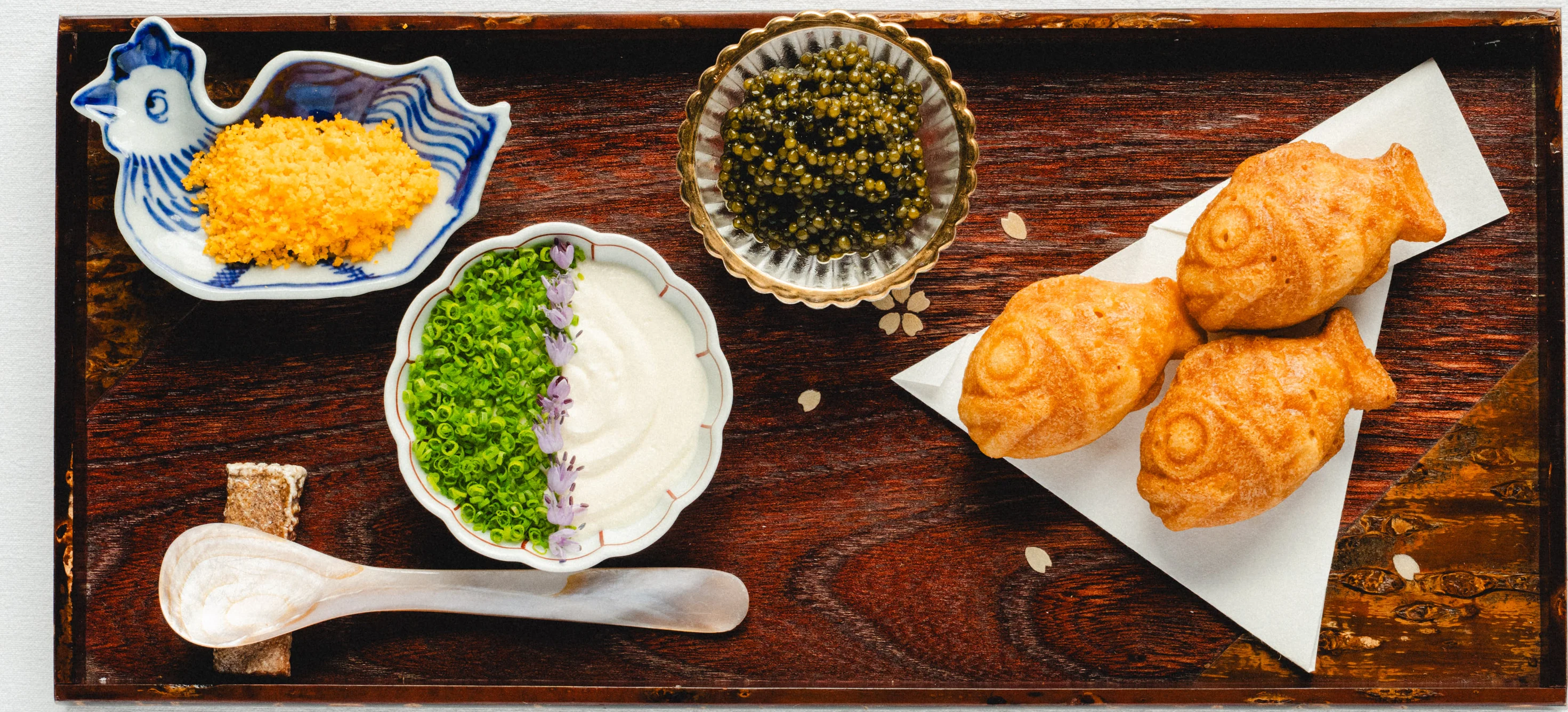 A beautifully arranged table with gourmet dishes and elegant tableware.