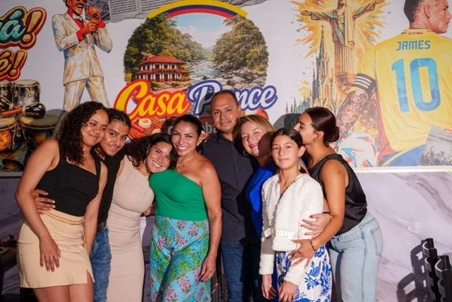 Family portrait at Casa Pance Gastropub welcoming guests
