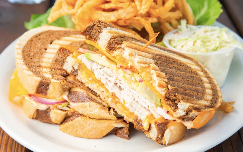 Grilled turkey sandwich with cheese and coleslaw