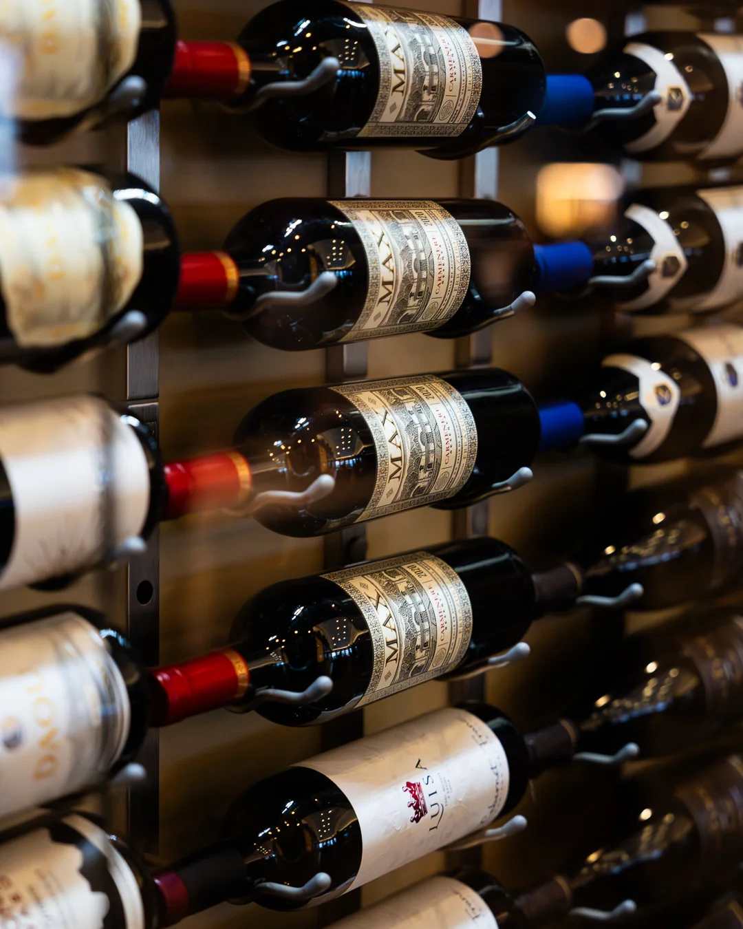 Wine bottles displayed in a modern wine rack
