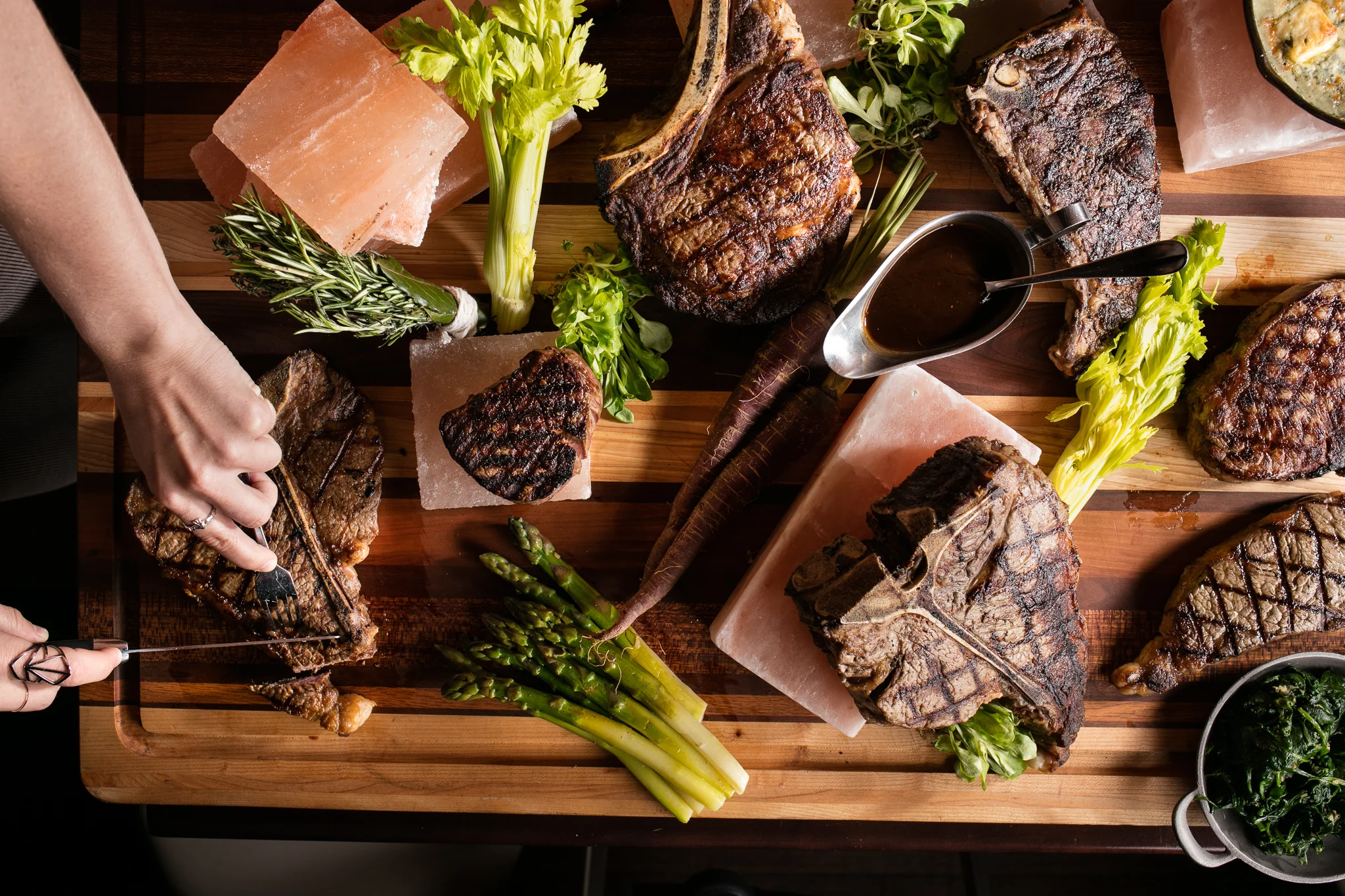 steak being cut on a cutting board