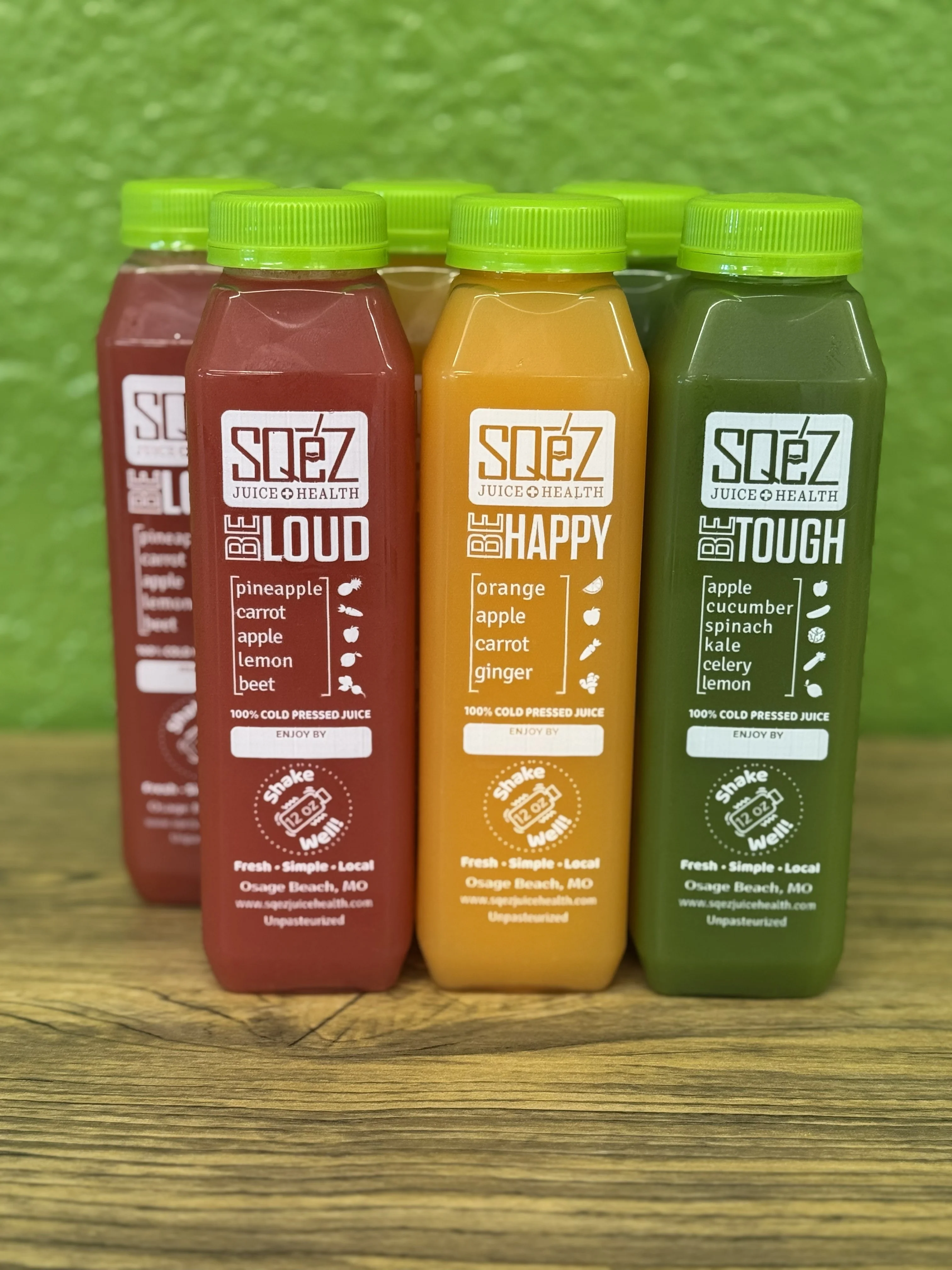 Tall six-pack of assorted beverages in a stylish display.