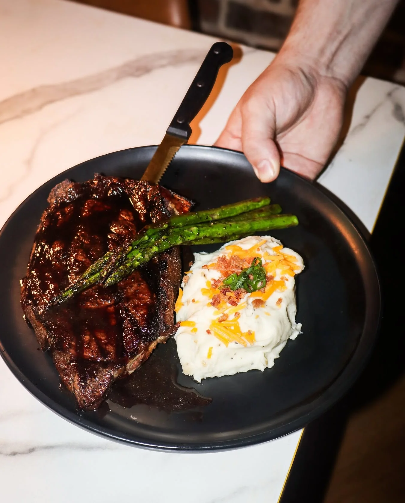 Grilled steak with mashed potatoes and asparagus