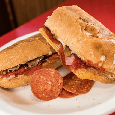 A pepperoni sub cut in half