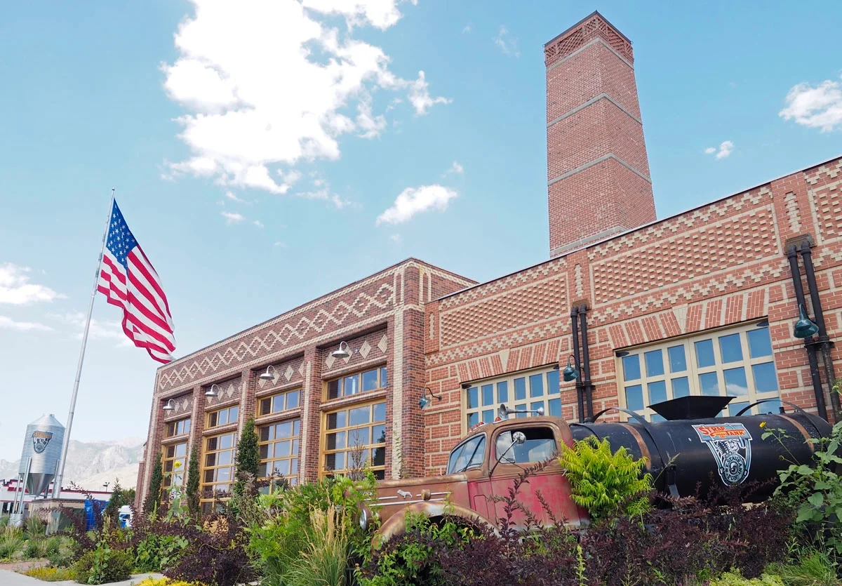Historic restaurant exterior with vintage truck and American flag