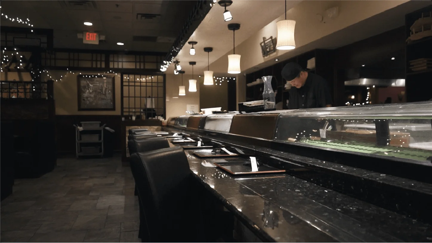 The sushi bar at Mahzu East Windsor with a chef working behind the counter