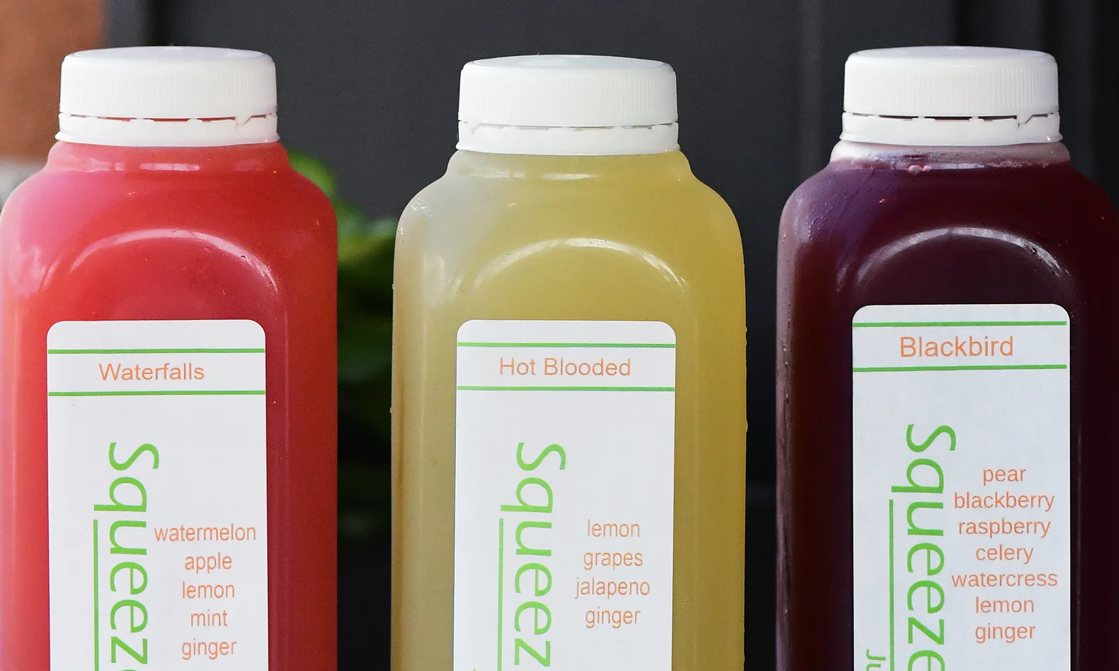 Colorful cold-pressed juice bottles from Squeezed