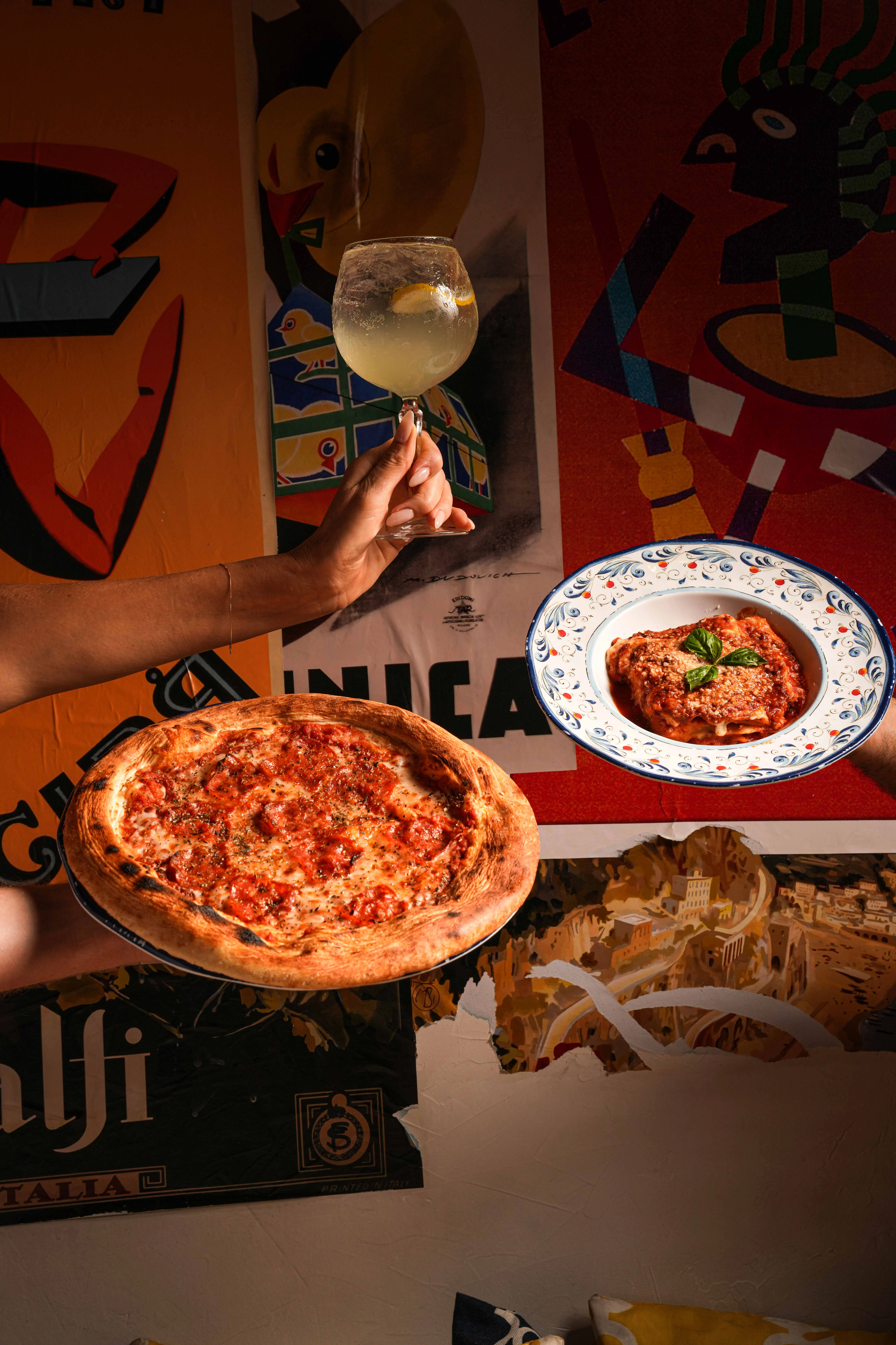 Delicious Margherita pizza and cocktail in a vibrant restaurant setting
