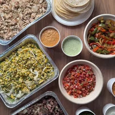 Mexican taco bar with assorted fillings and toppings