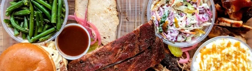 Southern barbecue platter with ribs, brisket, and sides