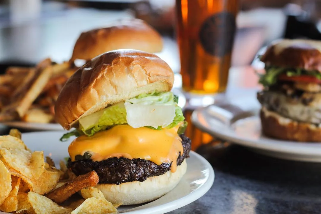 Juicy cheeseburger with lettuce and fries