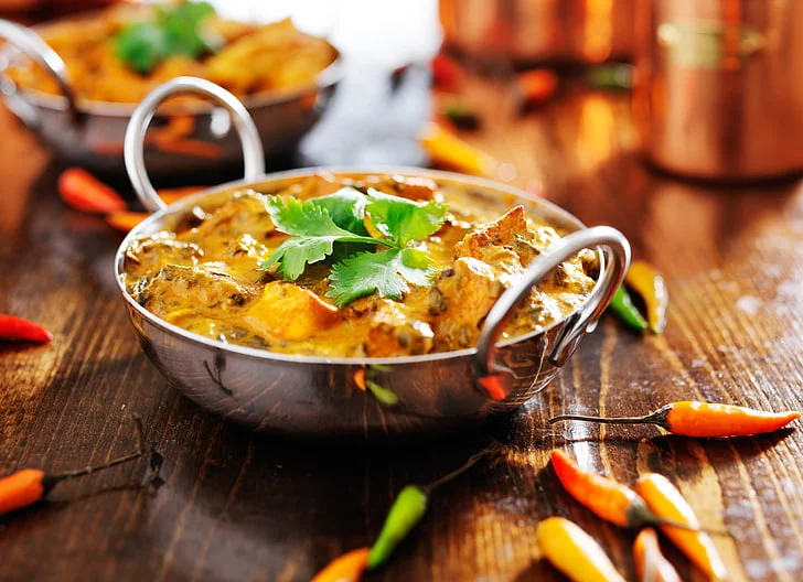 Creamy Indian butter chicken with cilantro garnish