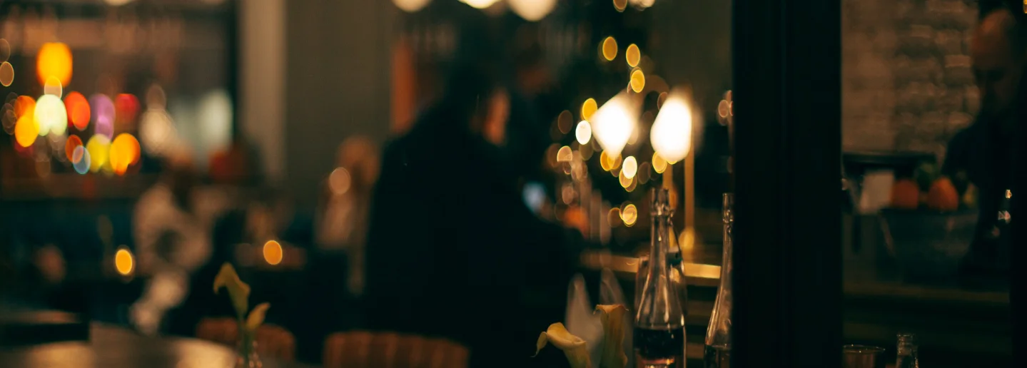 Cozy restaurant interior with warm lighting and blurred ambiance