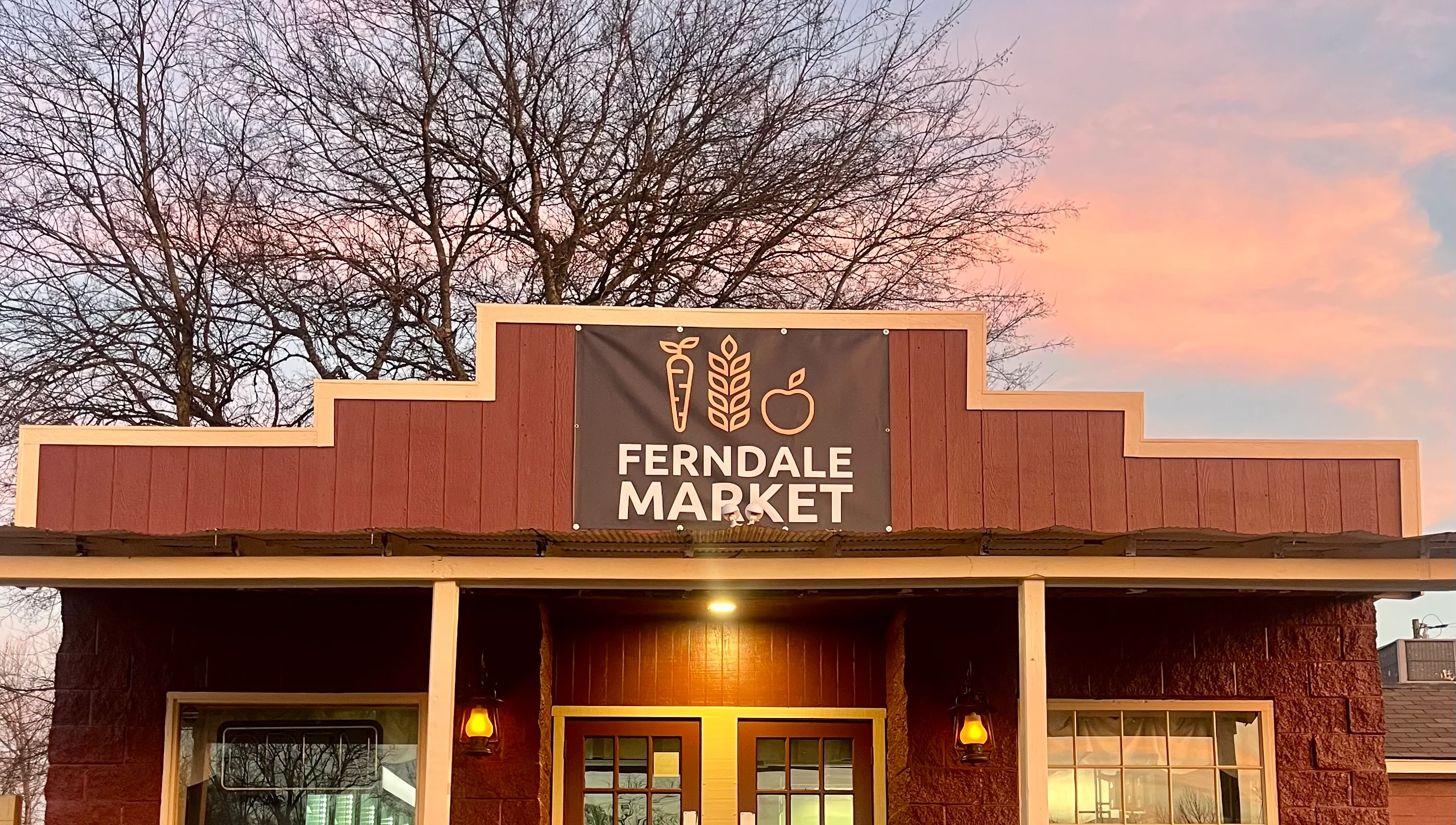 Charming market exterior with a welcoming entrance and a dog