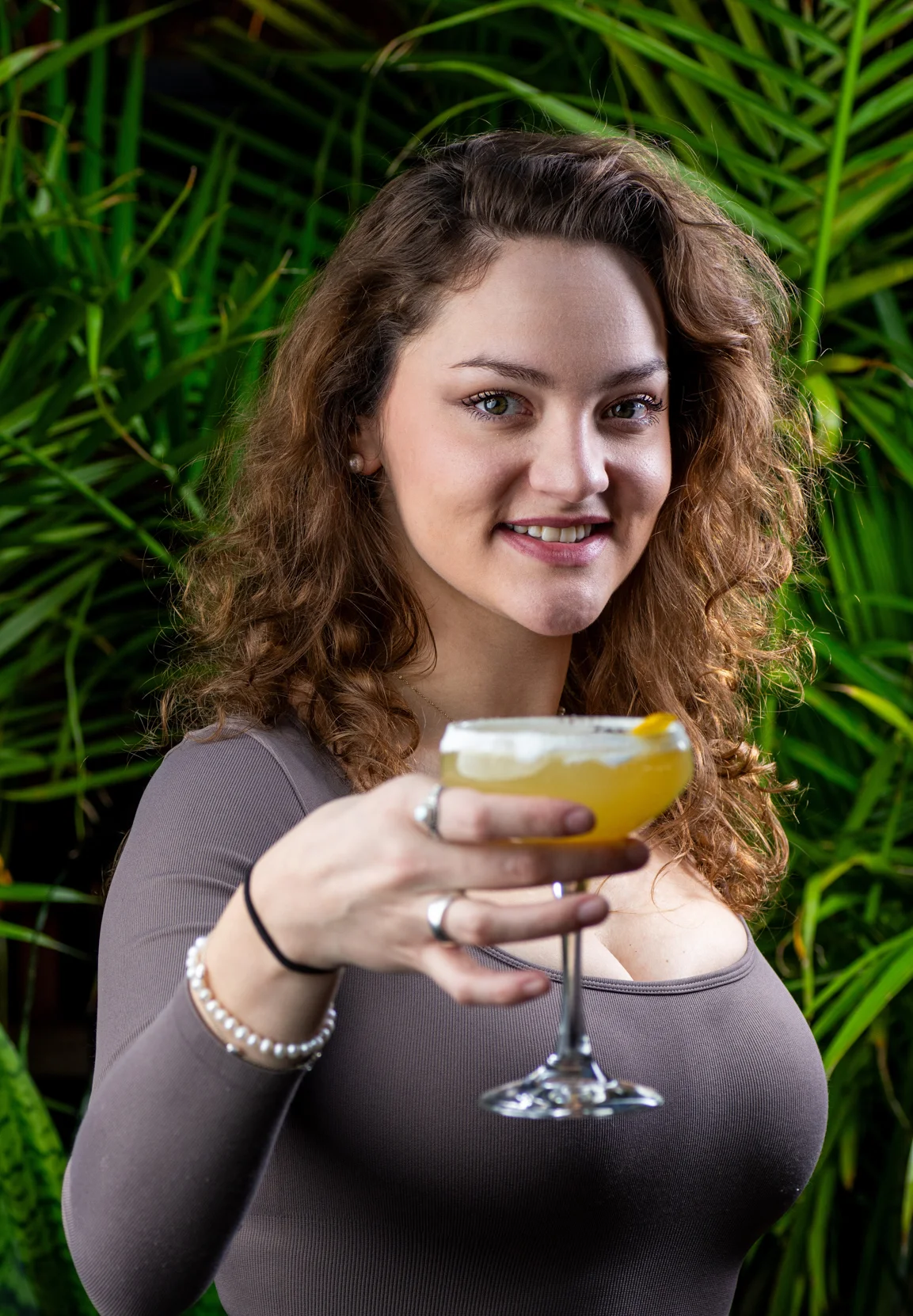 A Logan 11 customer holding a gifted mimosa