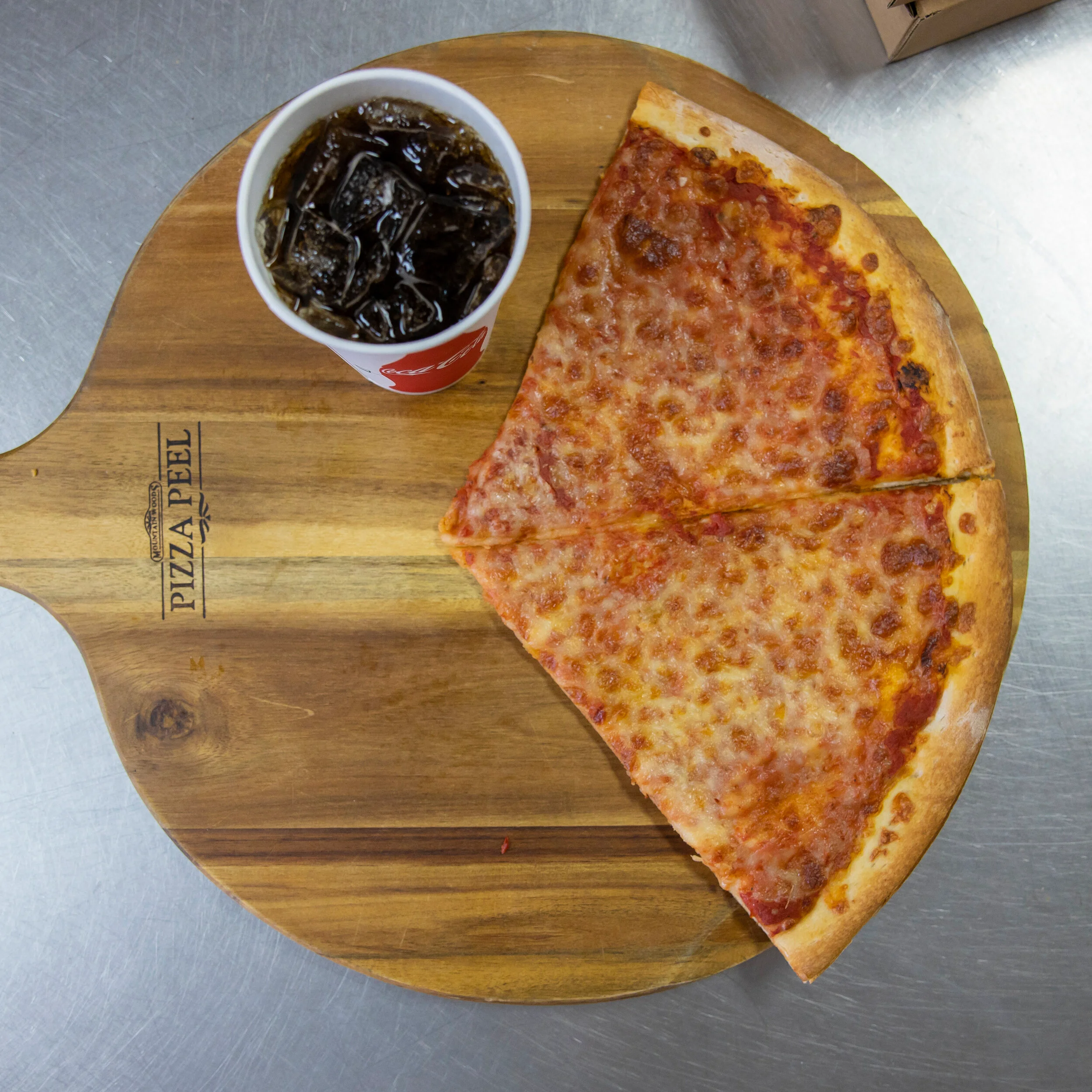Two slices of pizza and soda