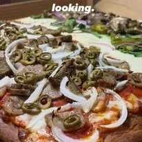 Delicious gourmet burger with fresh toppings on a wooden table