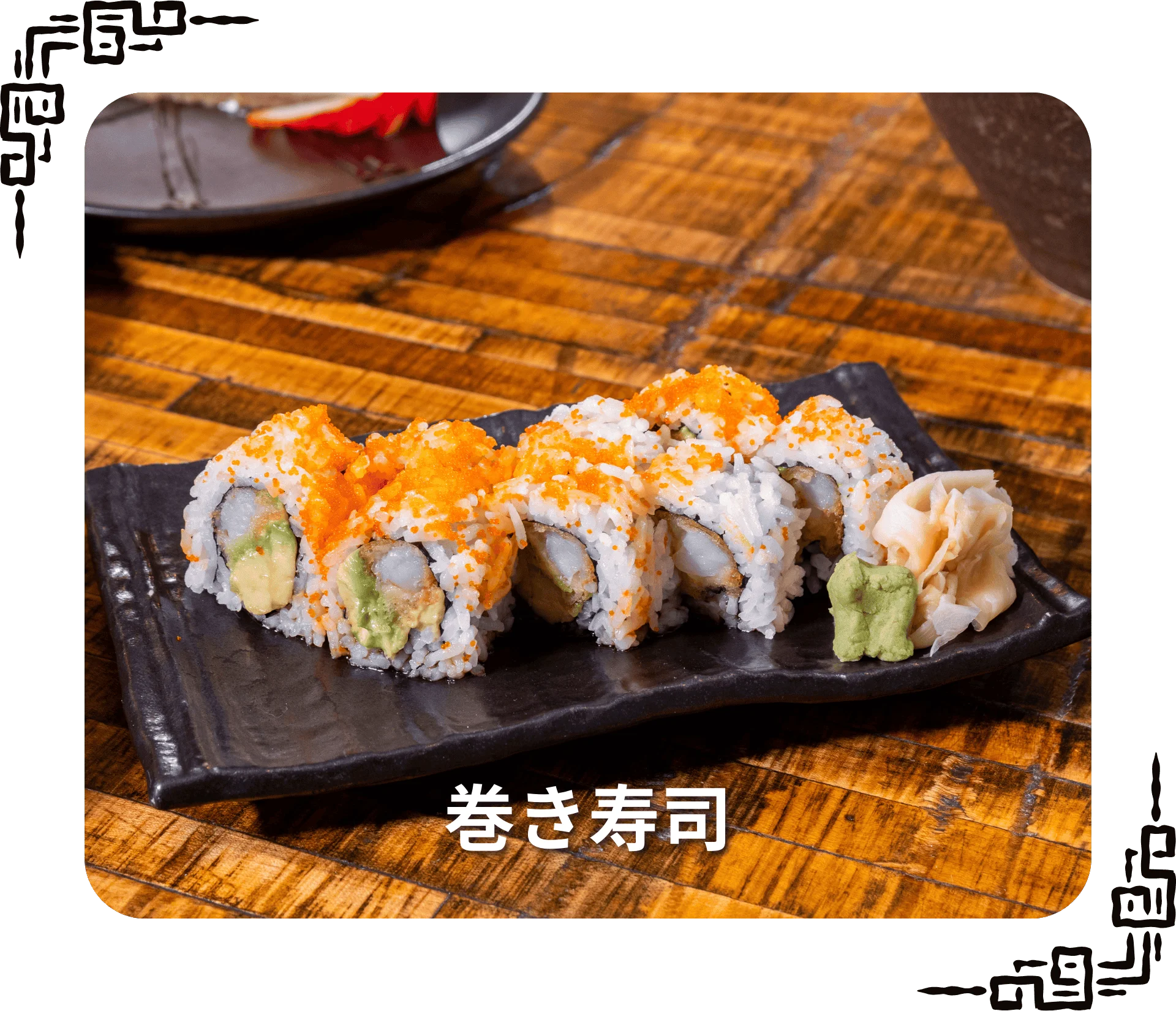Japanese sushi rolls with vibrant toppings on a black plate