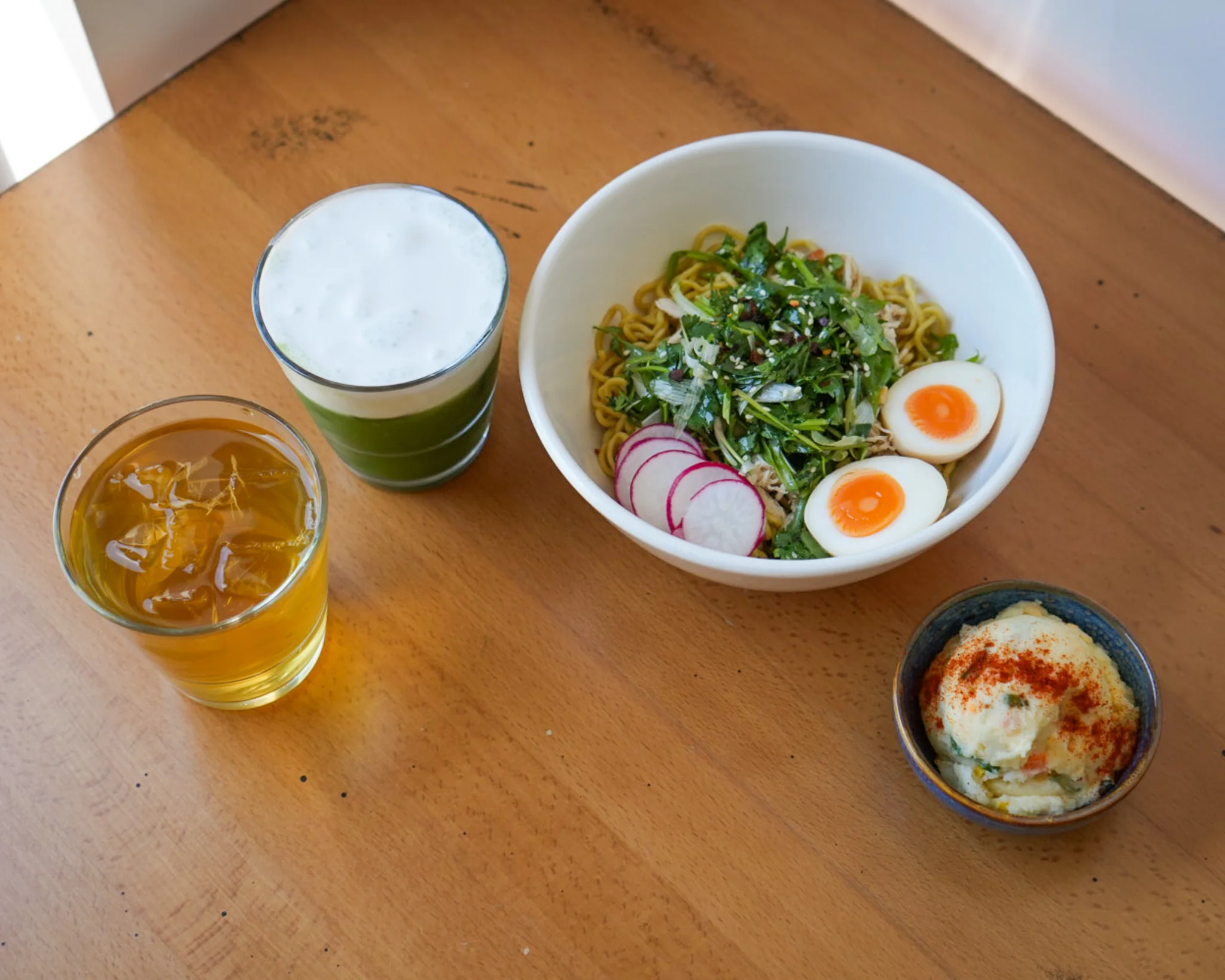 Japanese cold ramen with soft-boiled eggs and fresh vegetables