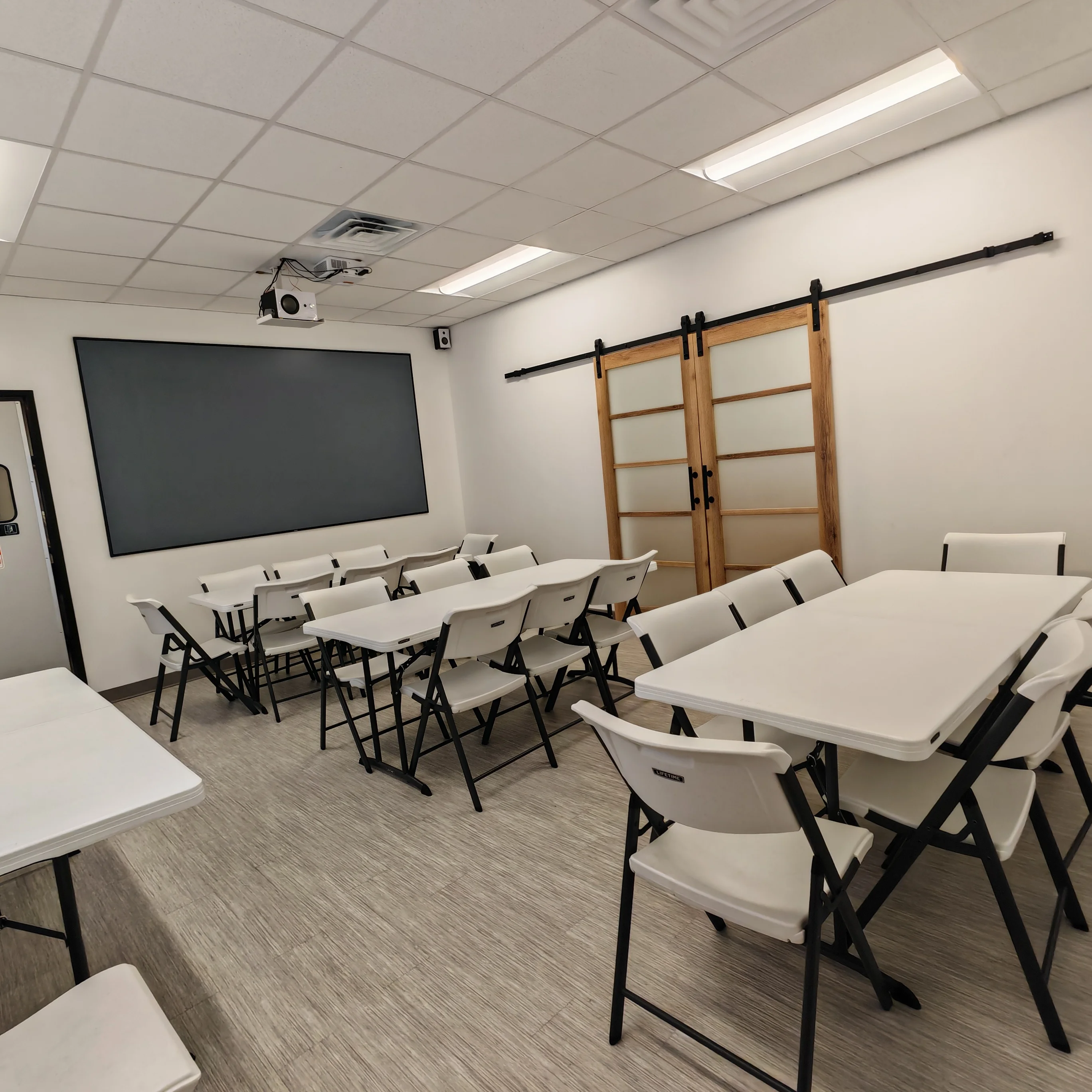 Modern meeting room with tables and projector