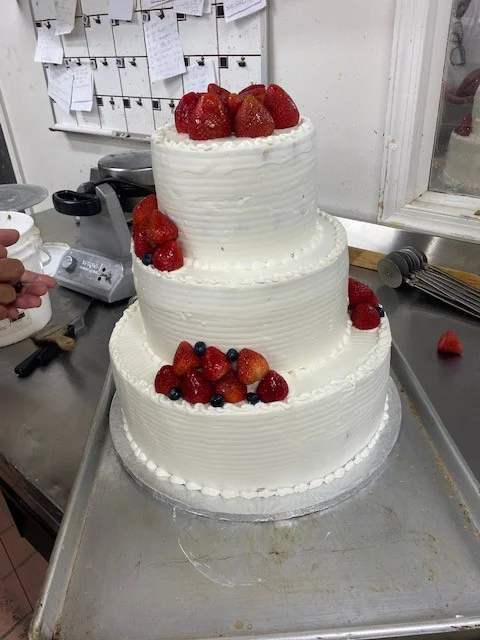 White tiered cake with fresh strawberries from The Kosher Pastry Oven