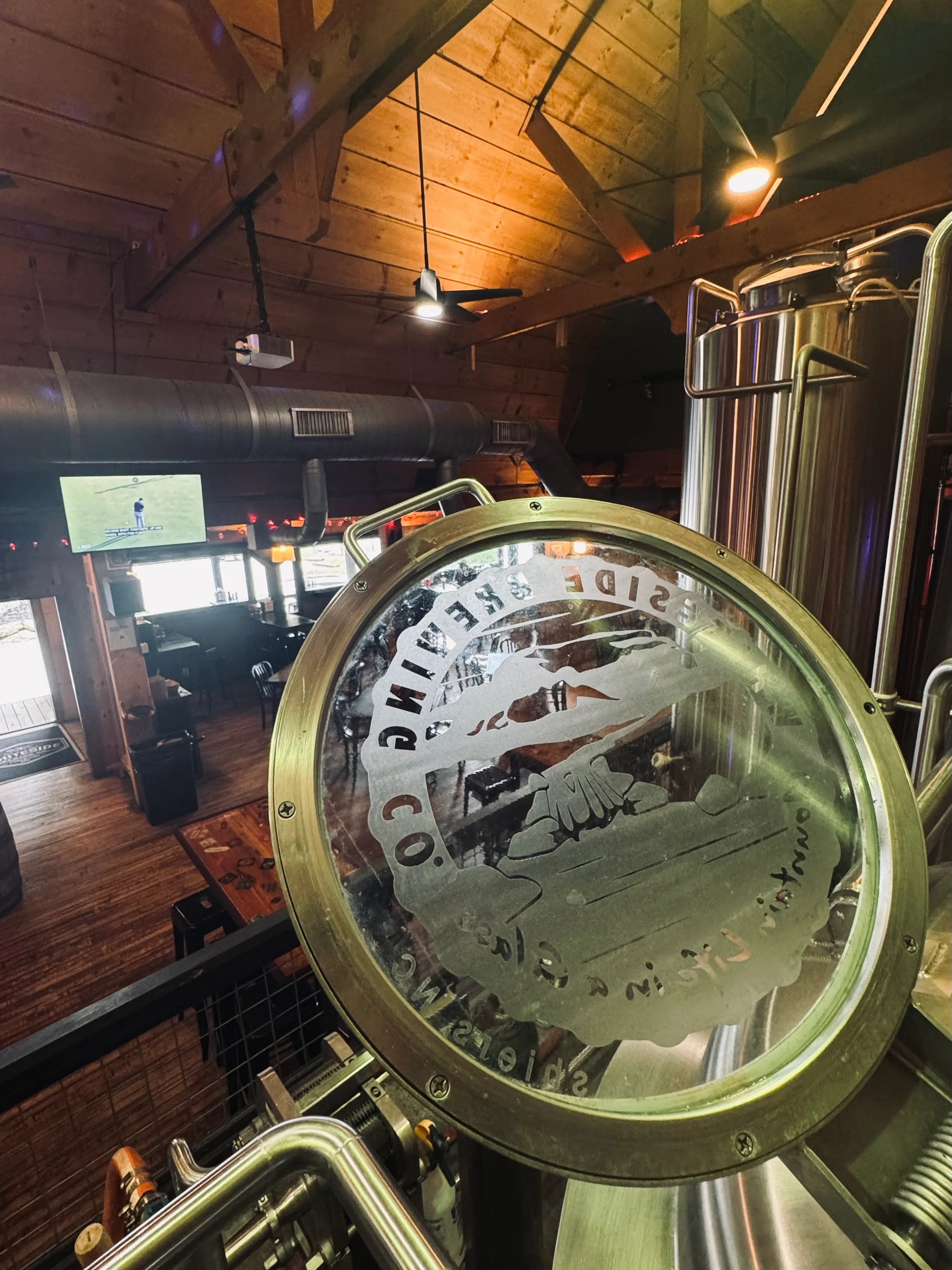 Craft beer in a glass at a brewery with a scenic view
