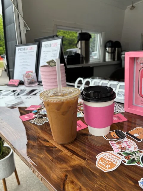Iced coffee drinks on a cafe table with colorful decor
