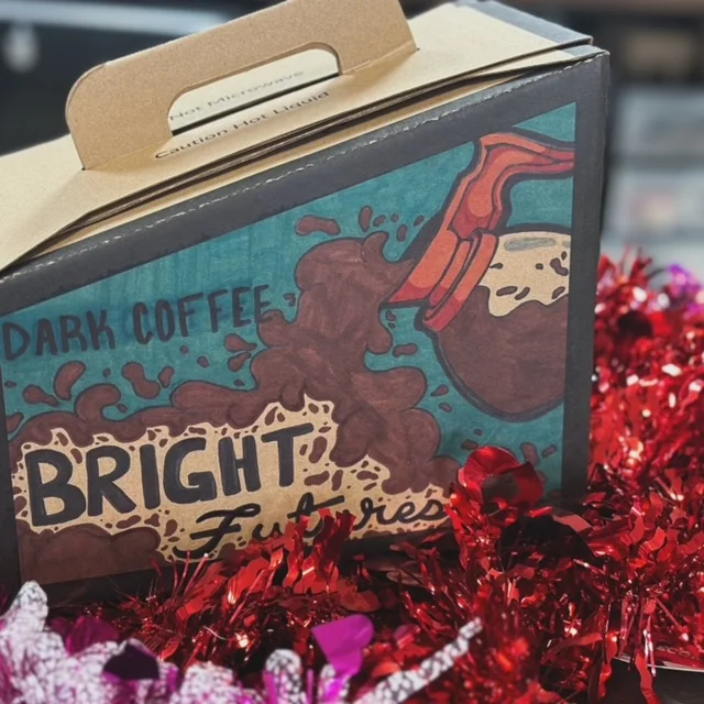 Brightly designed coffee box labeled 'Dark Coffee'