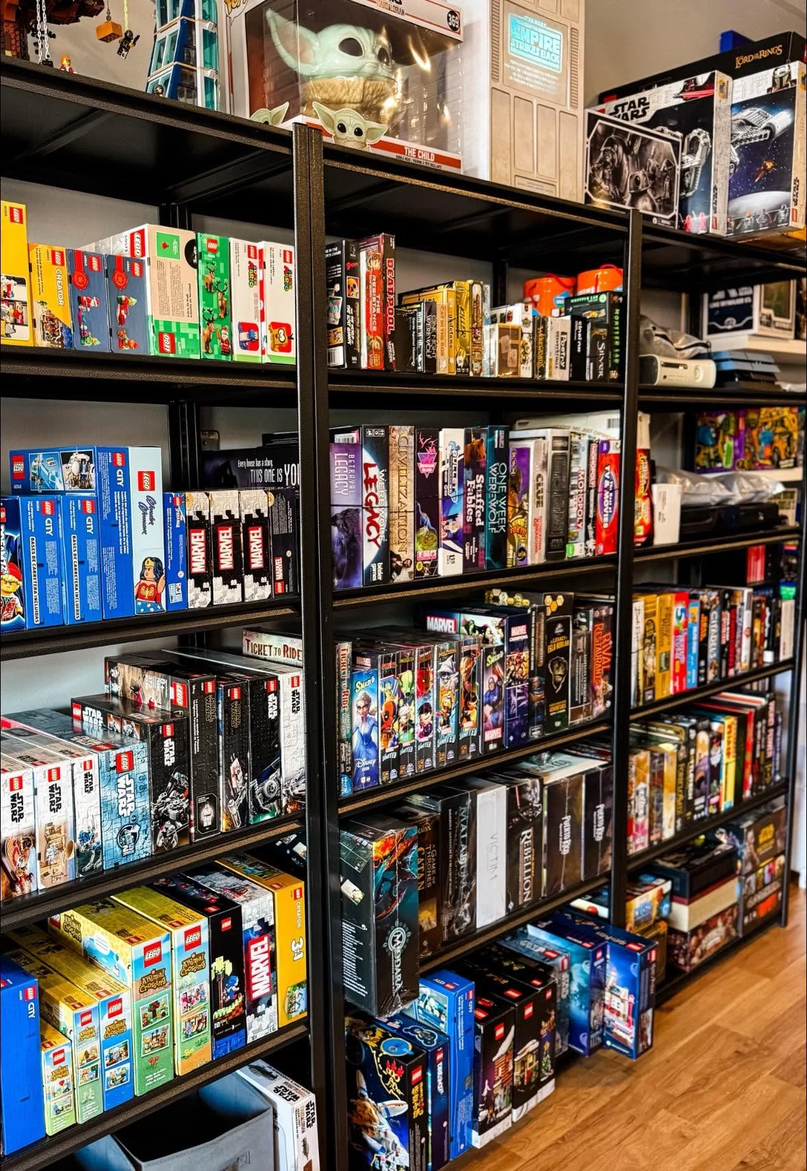 Colorful shelves filled with board games and LEGO sets