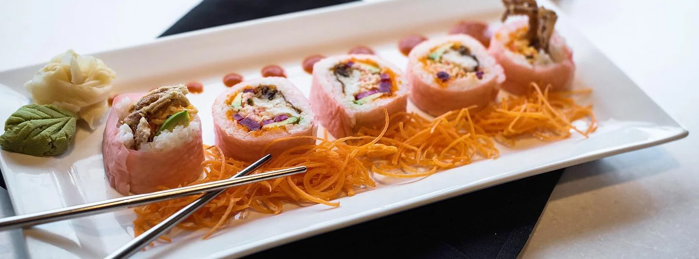 Colorful sushi rolls on a white plate