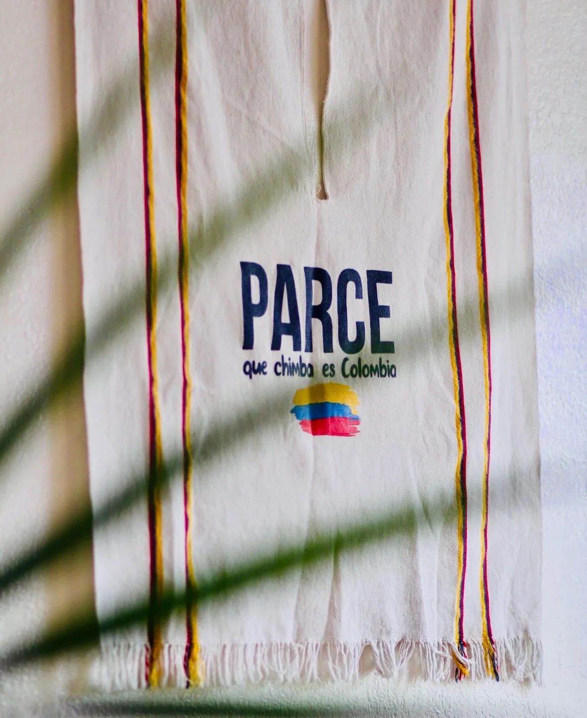 Colombian textile art with vibrant colors and cultural message