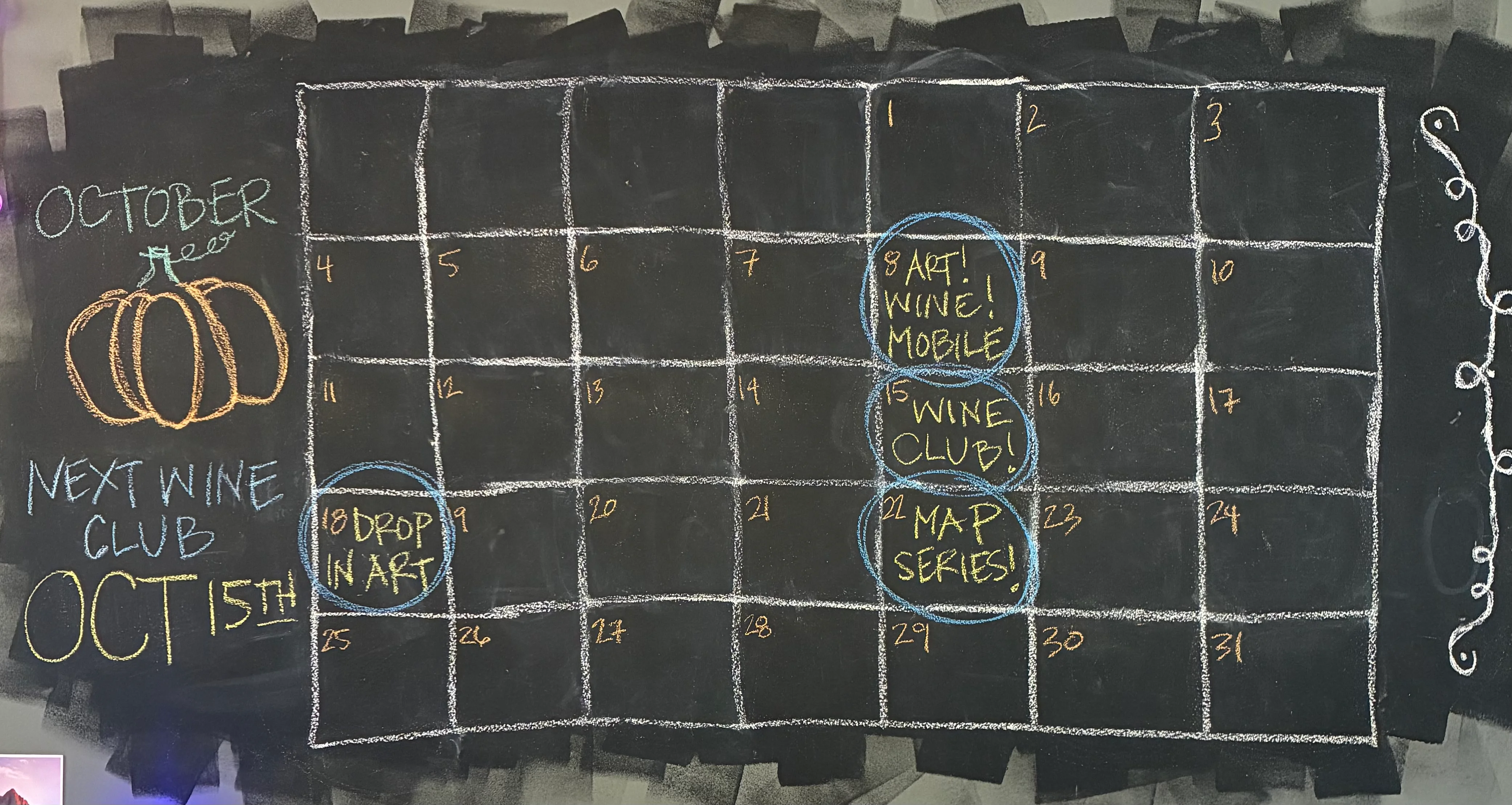 Chalkboard calendar for wine and art events in June and July