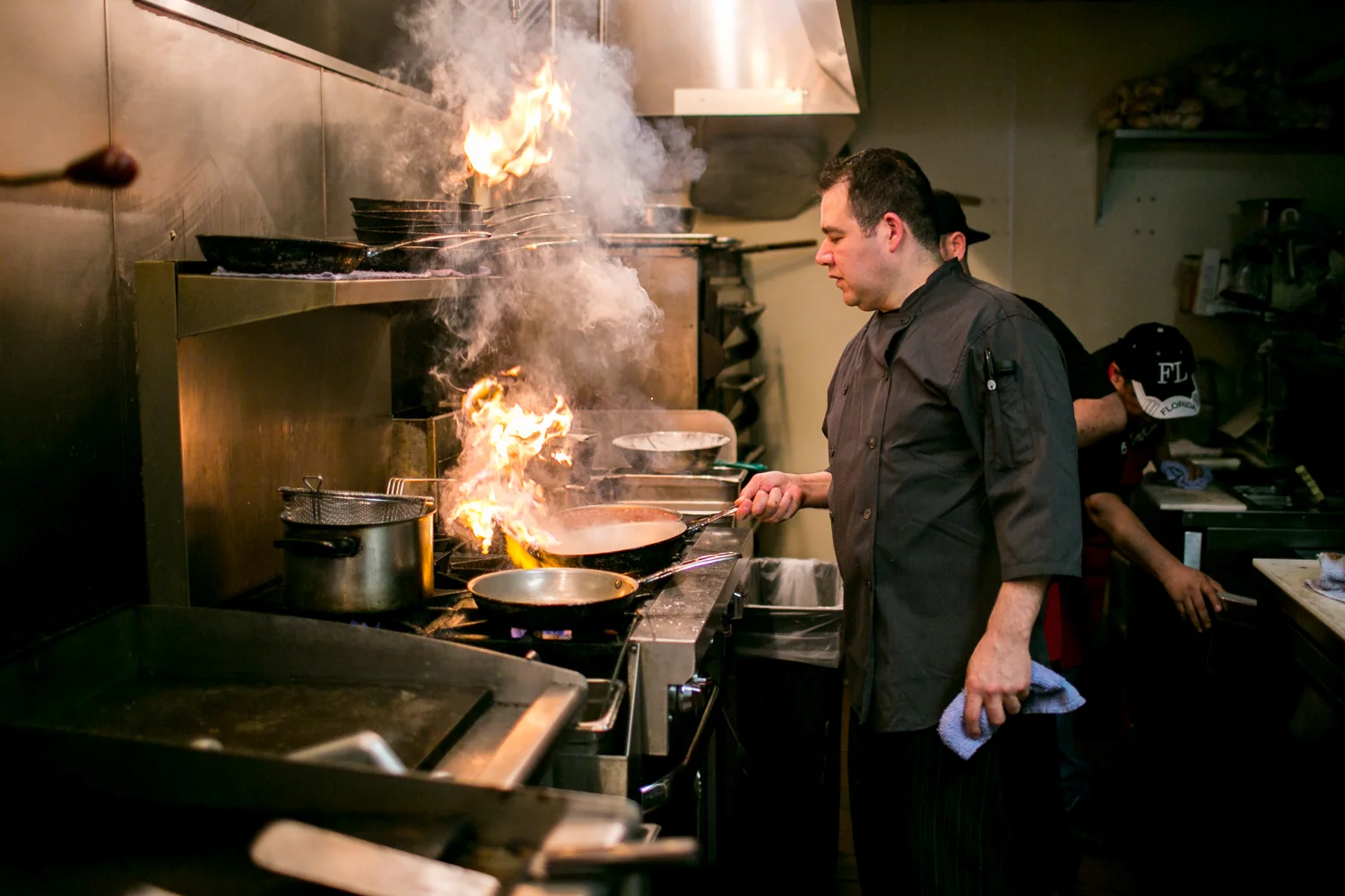 A restaurant chef preparing a dish
