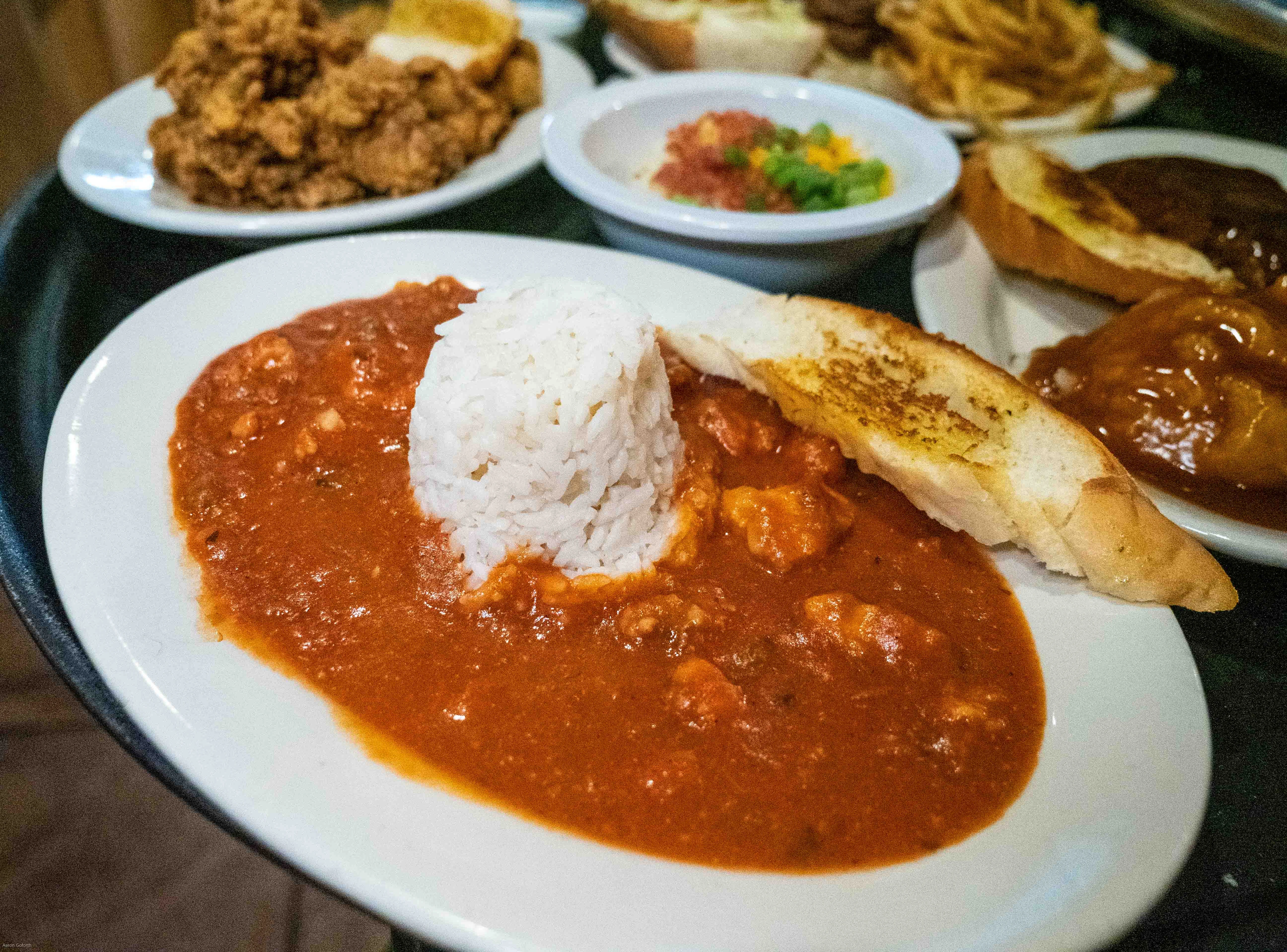 Savory Cajun gumbo served with rice and garlic bread