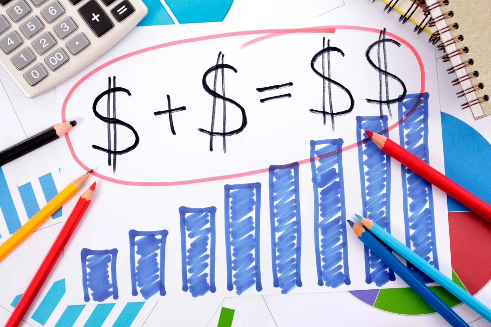 Financial growth chart with calculations and colored pencils