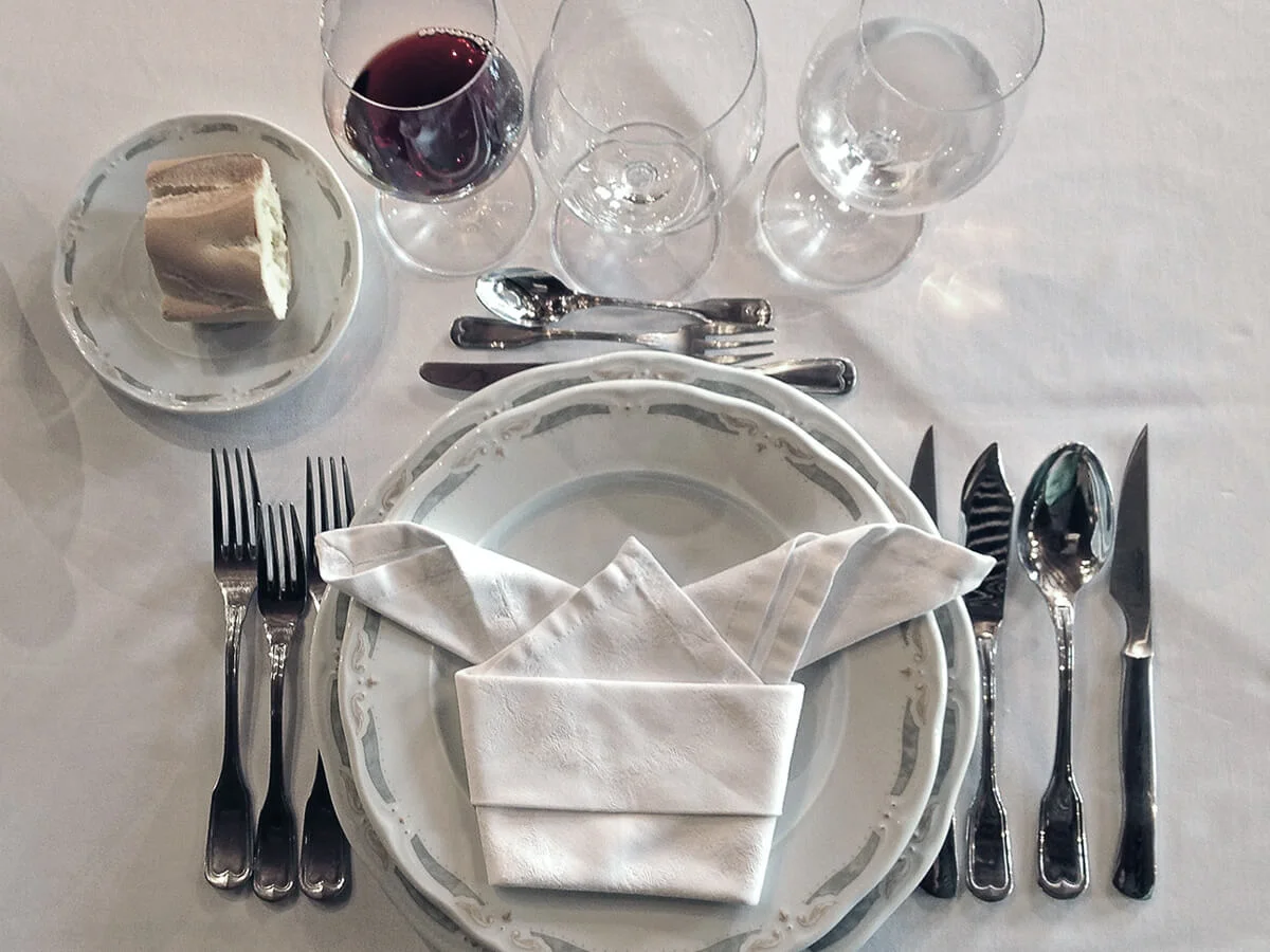 Elegant table setting with wine glasses and cutlery for a private event