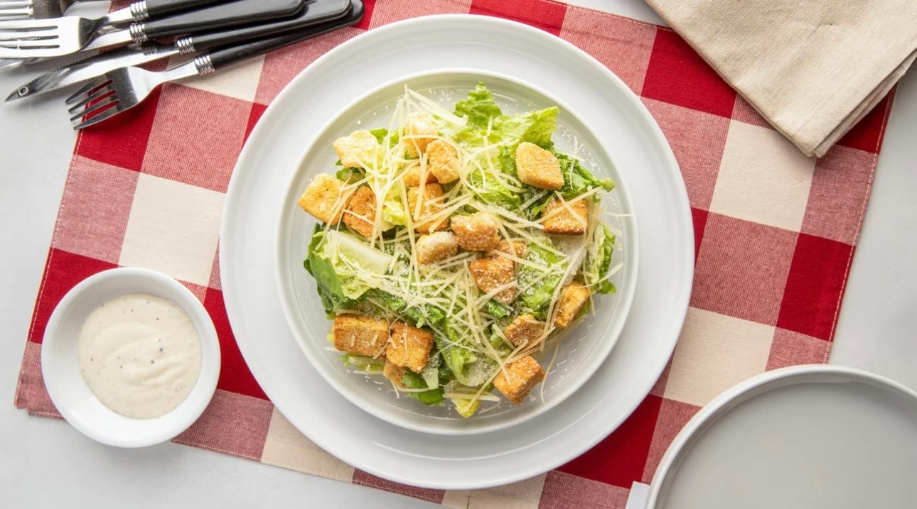 Classic Caesar salad with croutons and parmesan cheese