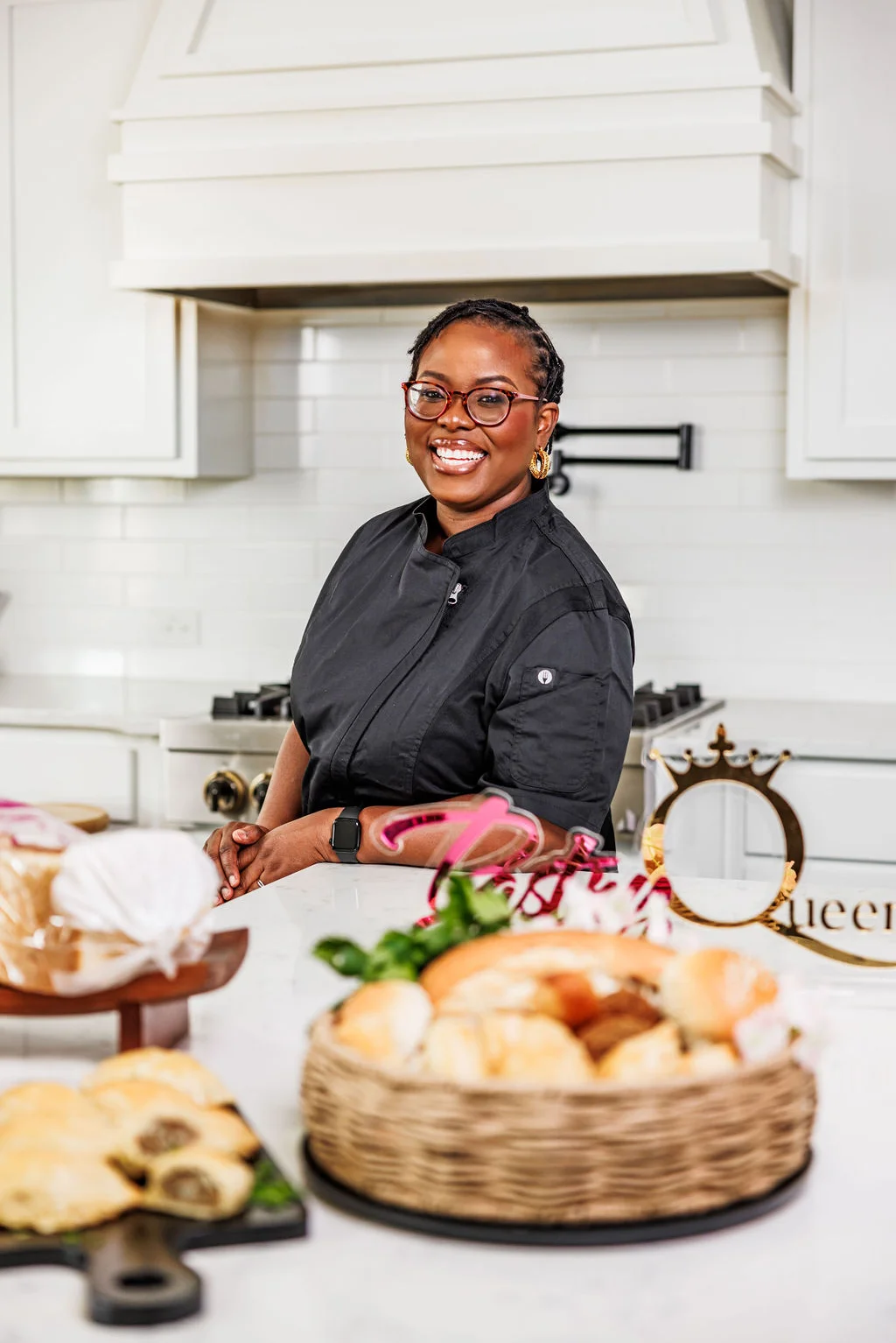 Chef smiling in a modern kitchen with freshly baked bread