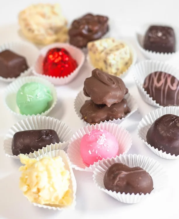 Assorted chocolate confections in decorative cups