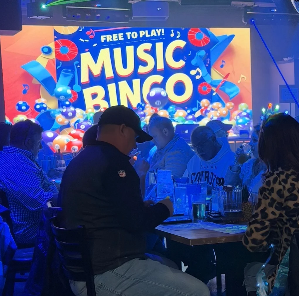 A lively music bingo event at a restaurant with participants enjoying.